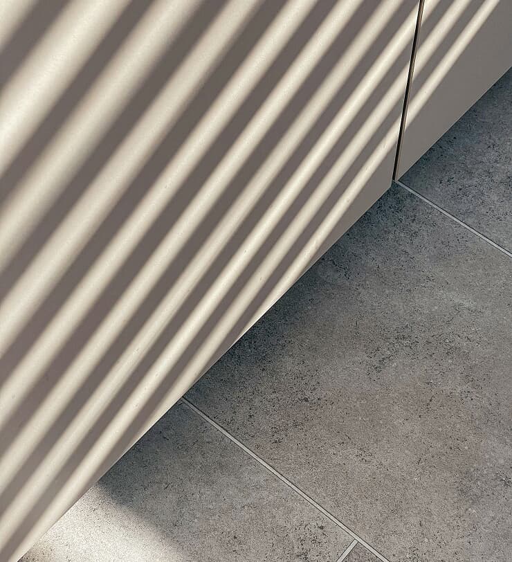 Textured floor detail with diagonal shadows